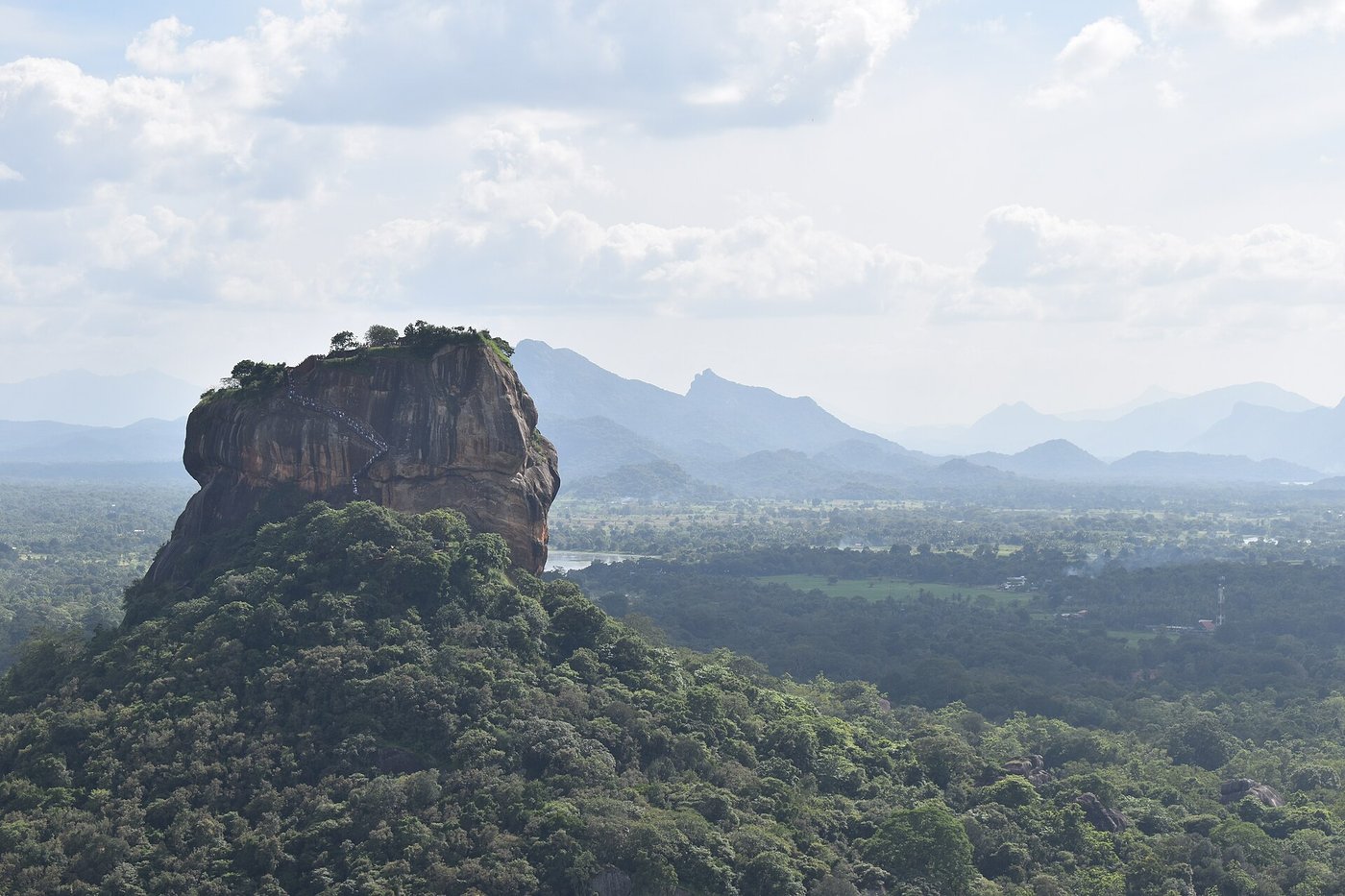 Aerial view of Sigiriya Rock Fortress rising above the jungle